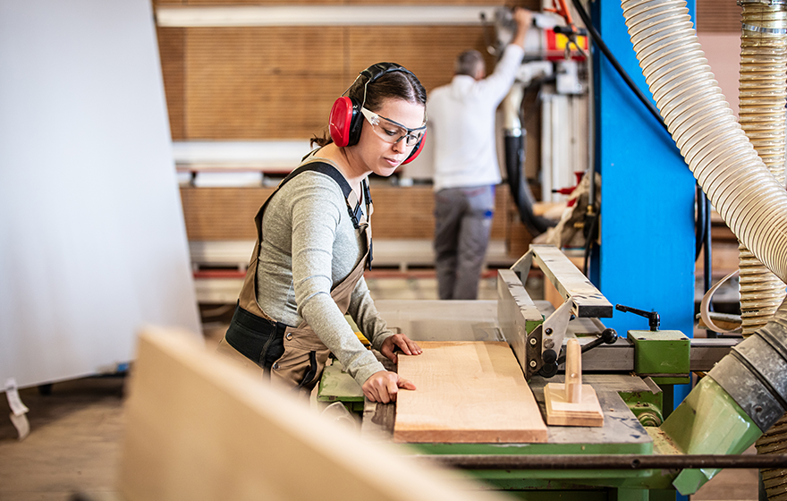 A carpentry student in the shop