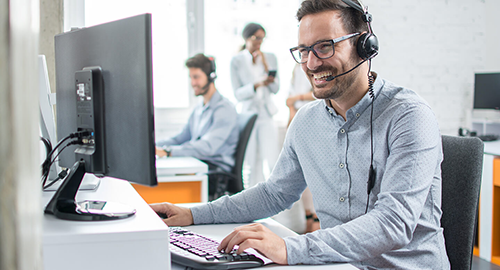 A customer service representative talking to a customer on the phone