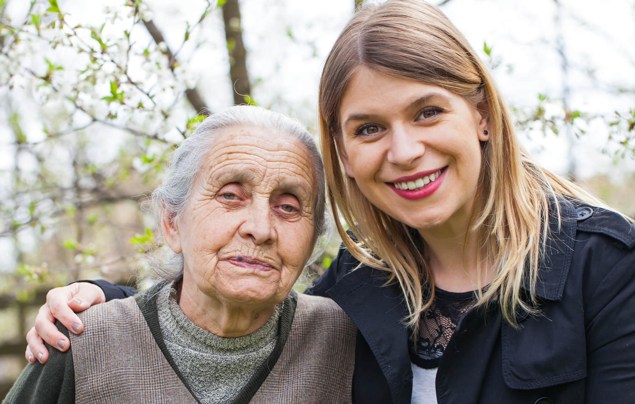 A caregiver pictured with an older adult