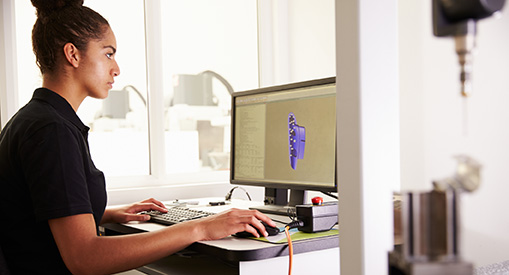 A CAD Designer working on a component with CAD software