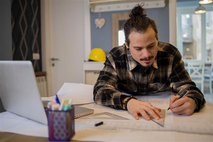 Student working and learning from the comfort of his own home