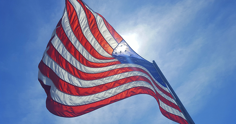 US Flag back-lit by the sun.