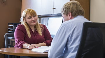 A counselor consulting a patient