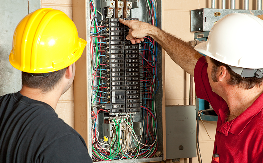 Electrician looking at a mother board
