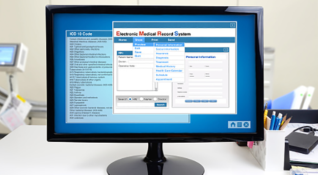 A computer with the Electronic Medical Record system on the screen