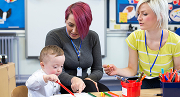 Early childhood special needs assistant working with a student