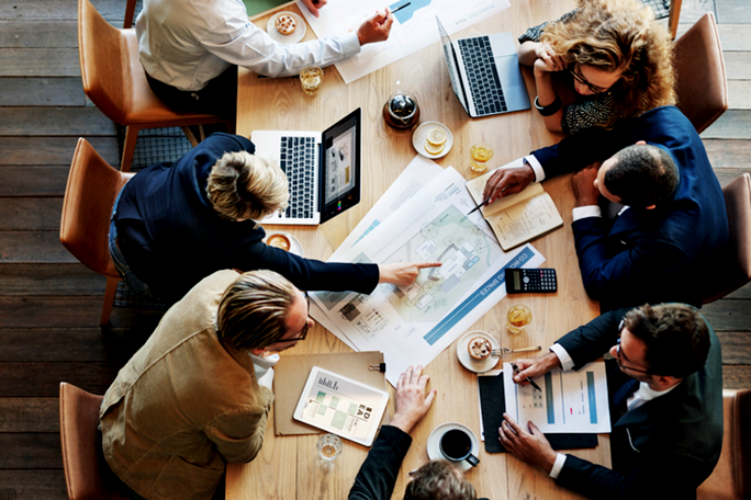 Business professionals working at a table together