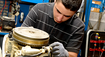 Marine Repair Tech repairing a motor