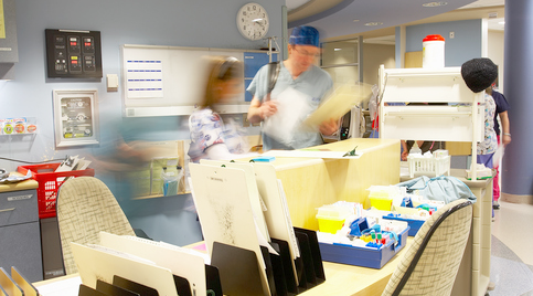 A busy receptionist desk in a hospital