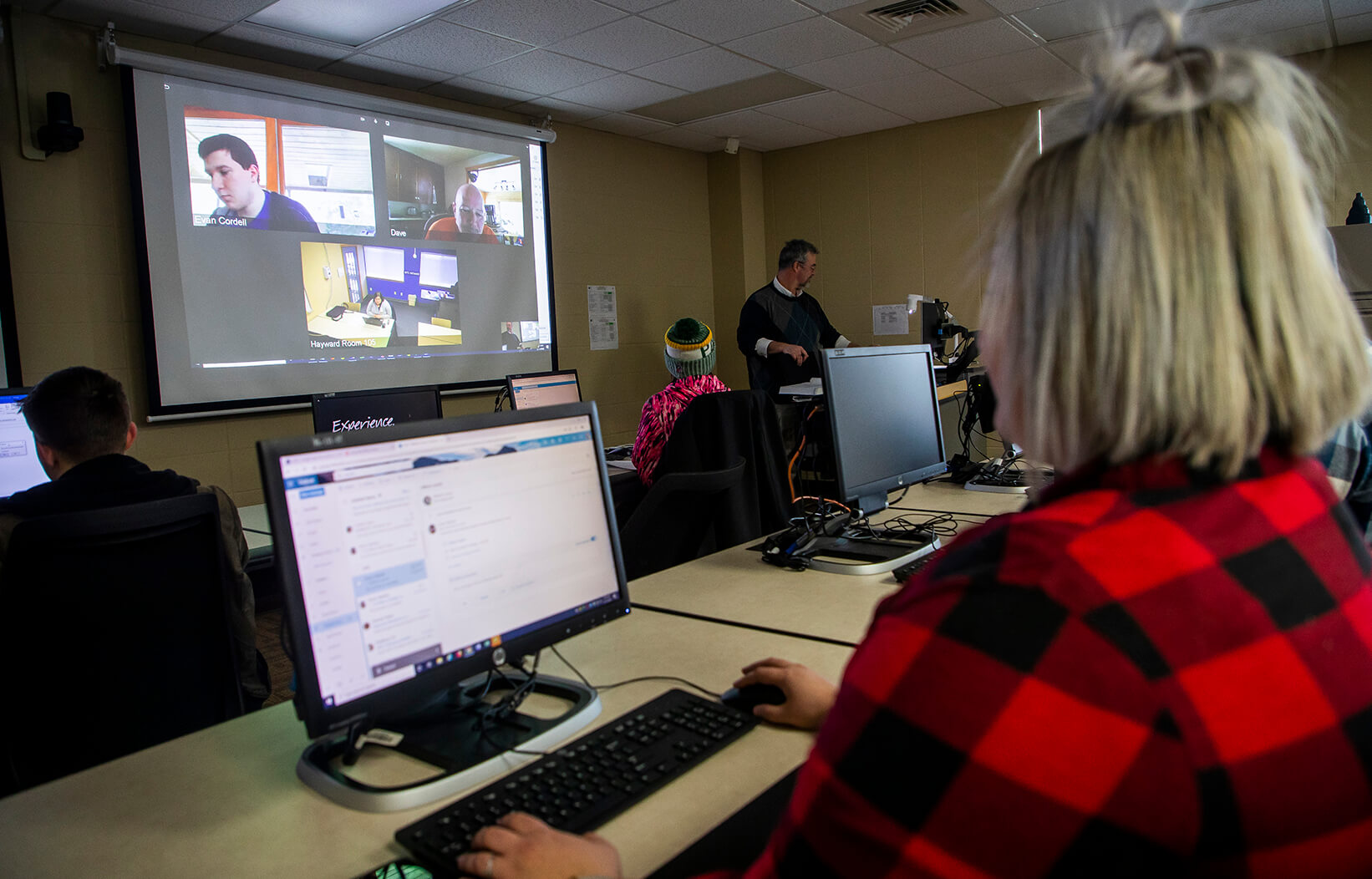 Students in a classroom and students virtually attending the same class