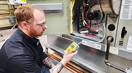 Student working hands-on with with equipment used in the HVAC/R industry