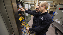 HVAC/R students using technology and equipment in WITC's HVAC/R lab