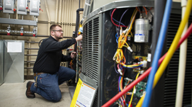 Students working hands-on with with equipment used in the HVAC/R industry