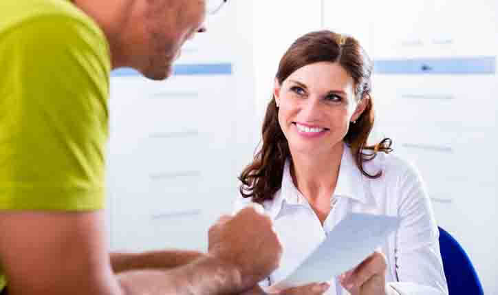 A medical information clerk helping a customer