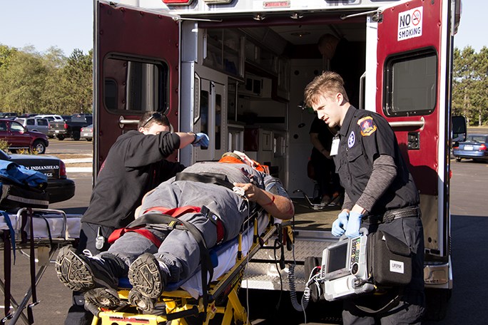 EMT students going through an emergency situation simulation