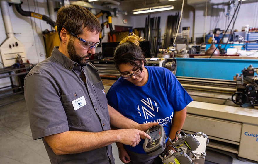 Student getting instructions from IMT instructor