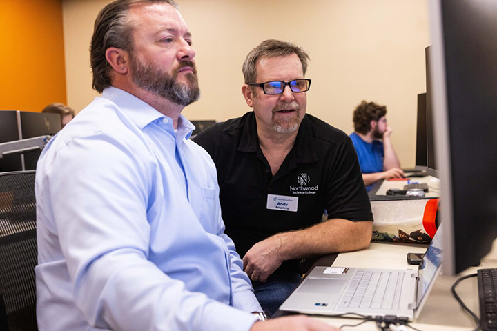 Northwood Tech instructor and student using a computer in a lab