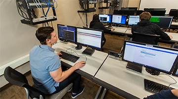 A student working on a computer in the lab