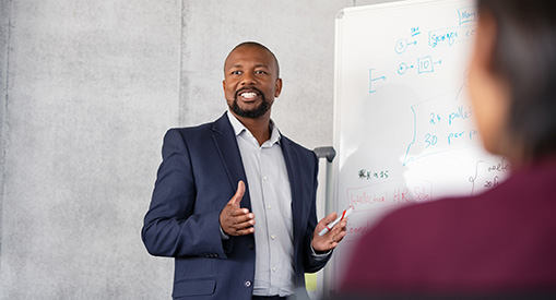 A business leader making a presentation to a team