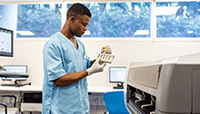 Male lab tech working in a lab