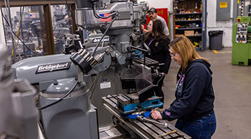 Student working in machine shop