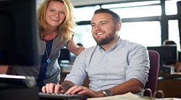 A student in class with instructor in background