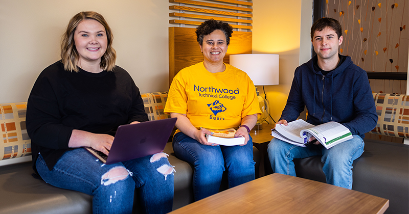 Three students sitting in the student lounge 