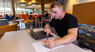 Student studying at a table