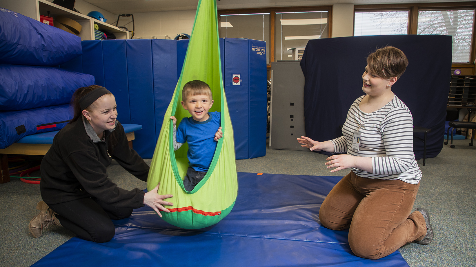 A student practicing their skills with a child