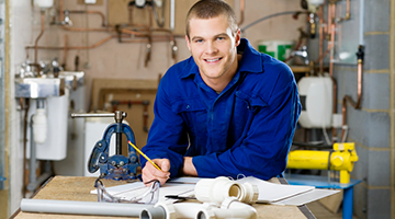 plumbing student sitting at work station