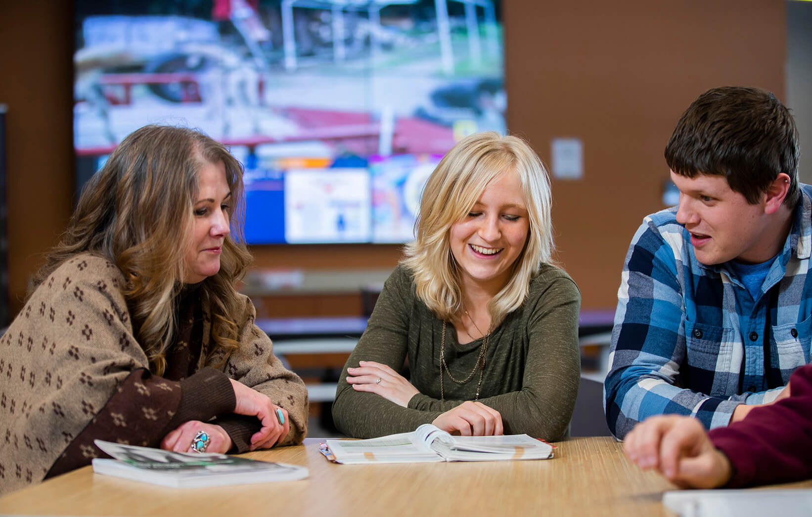 Student studying at a table in The Hub