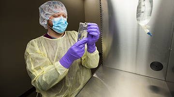 A pharmacy technician preparing chemo