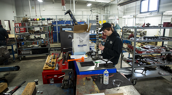 A student doing hands-on work in the shop