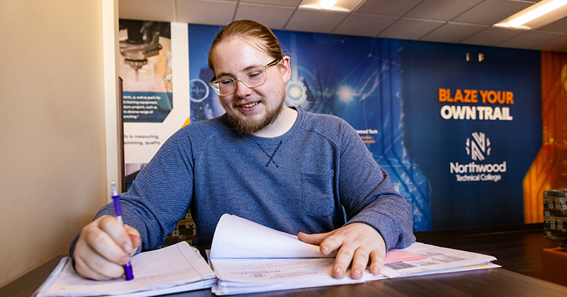 Student on campus going through homework