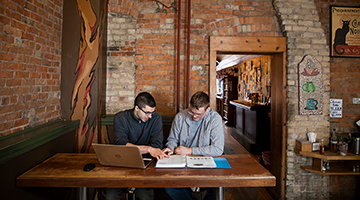 Students working together in a cafe