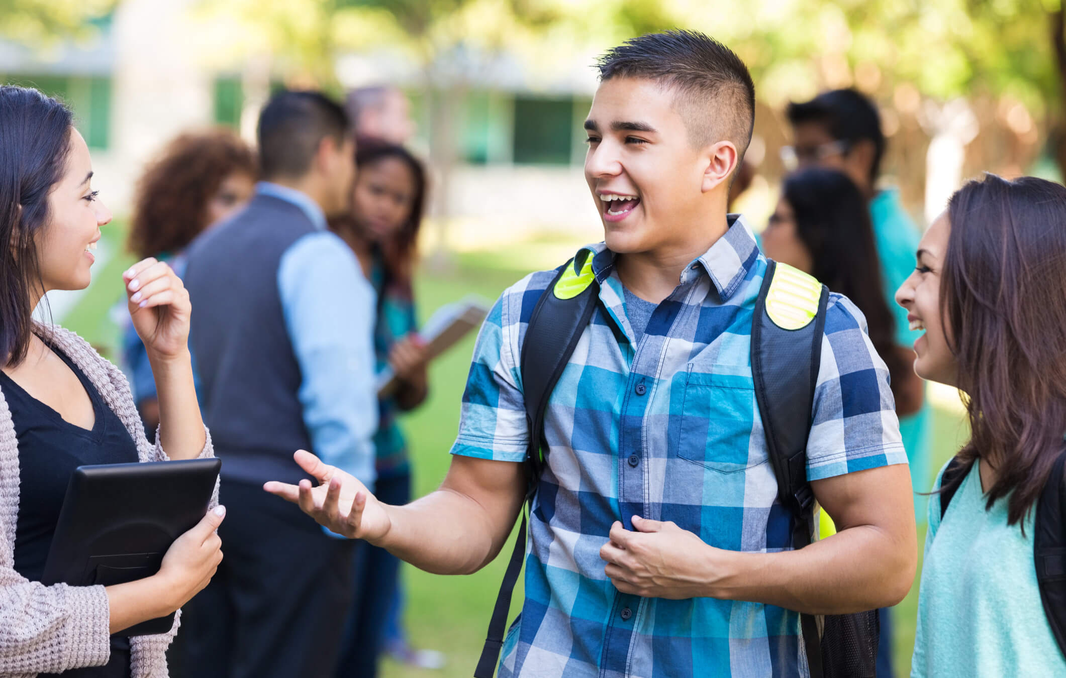 Students talking in a group outside