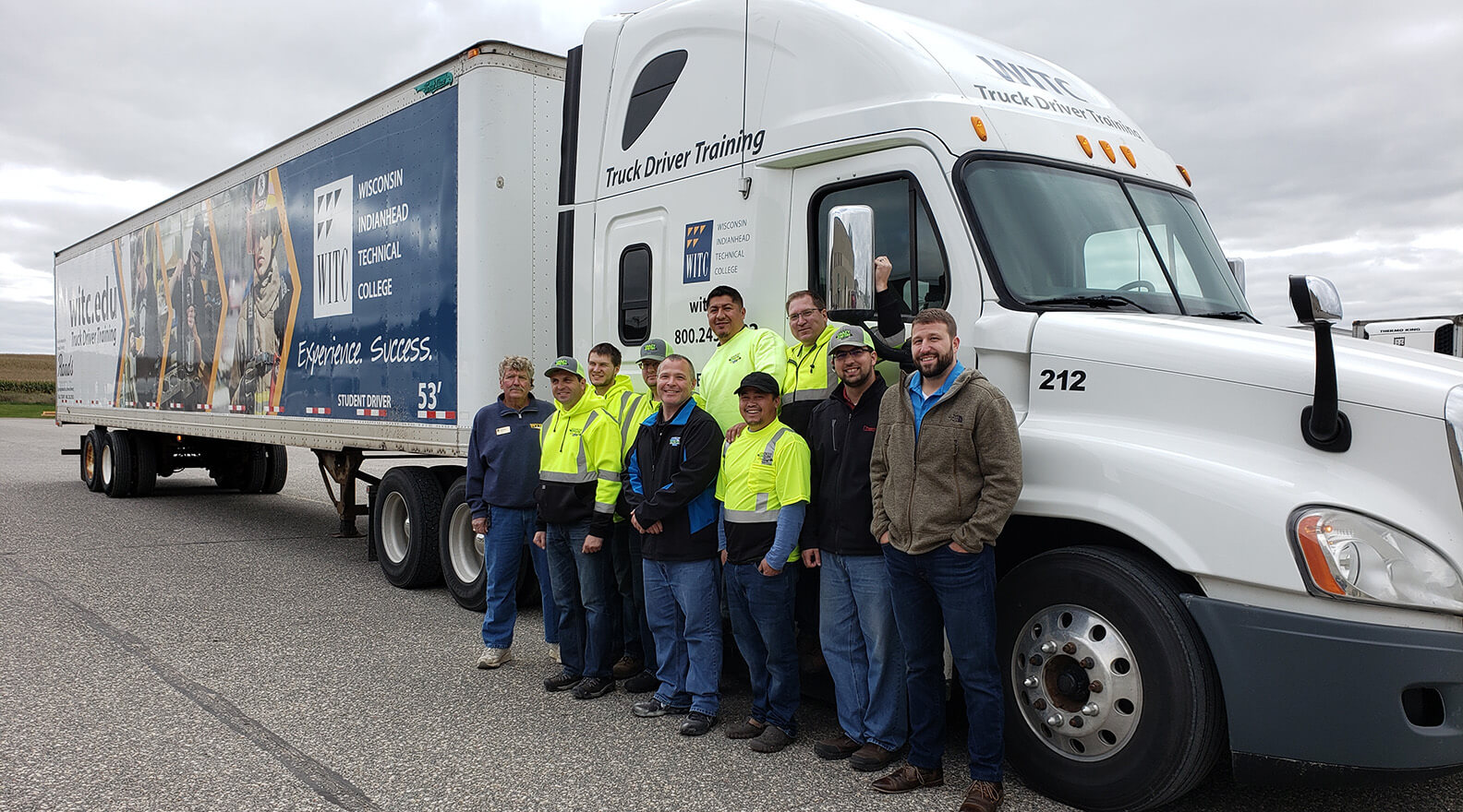 WITC Truck Driving students standing outside the semi truck
