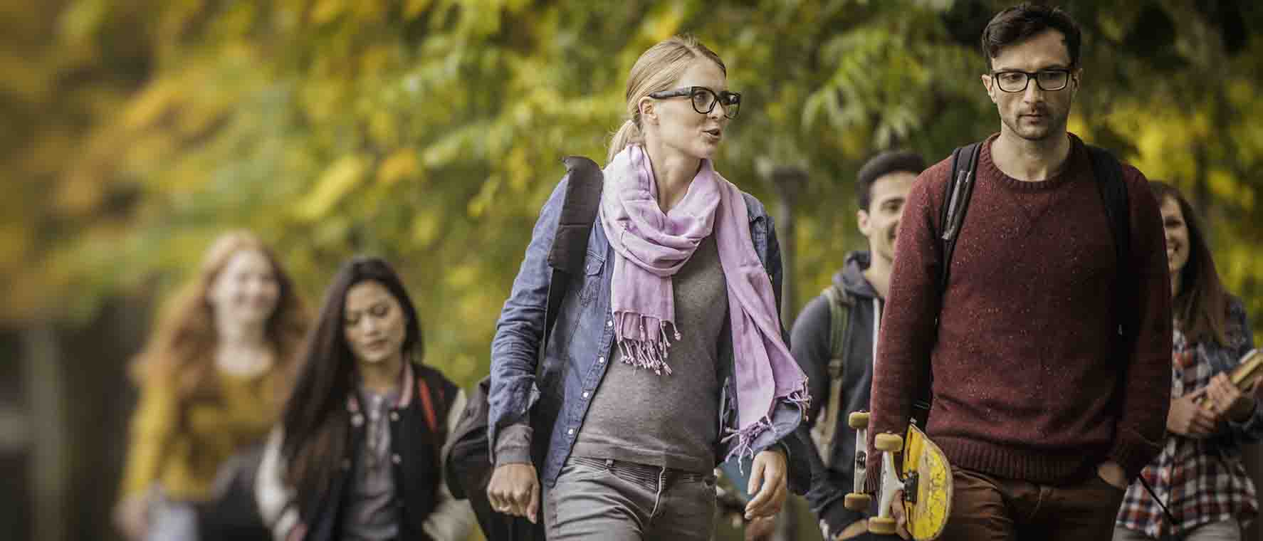 Students walking outside on a fall day