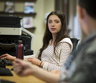 Girl works in the computer lab