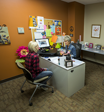 Student and WITC advisor sitting in an office at a table Student and WITC advisor sitting in an office at a table