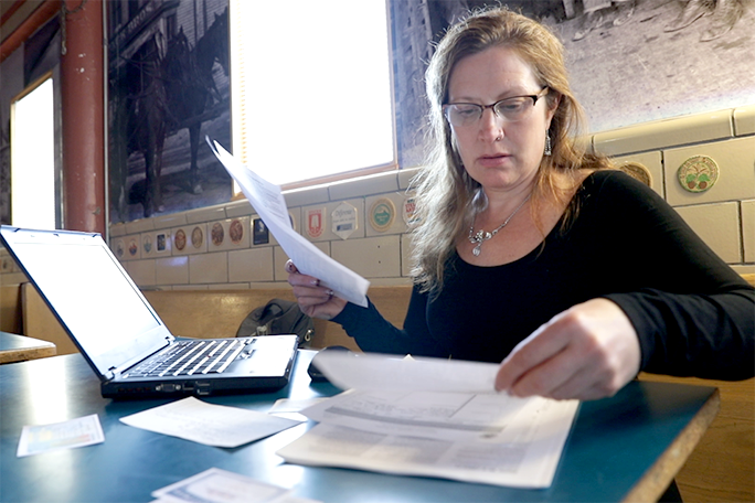 A business owner going through documents