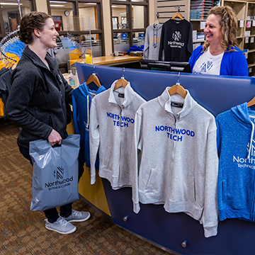 Northwood Tech student purchasing Northwood Tech merch in the bookstore