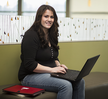 A WITC student using a laptop