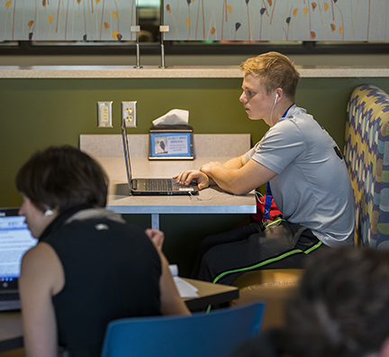 A student working on a laptop