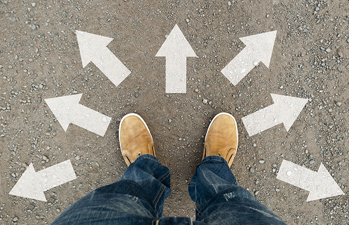 Looking down at feet with arrows pointing off in various directions