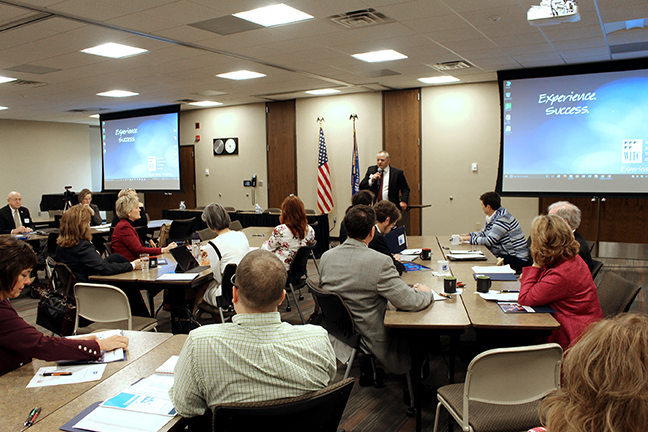 WITC President John Will speaking to Wisconsin's state representatives, business leaders and community members