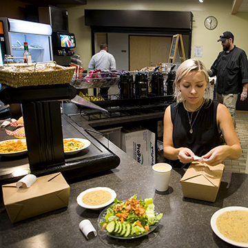 Paperjack Creek Cafe employee getting preparing food