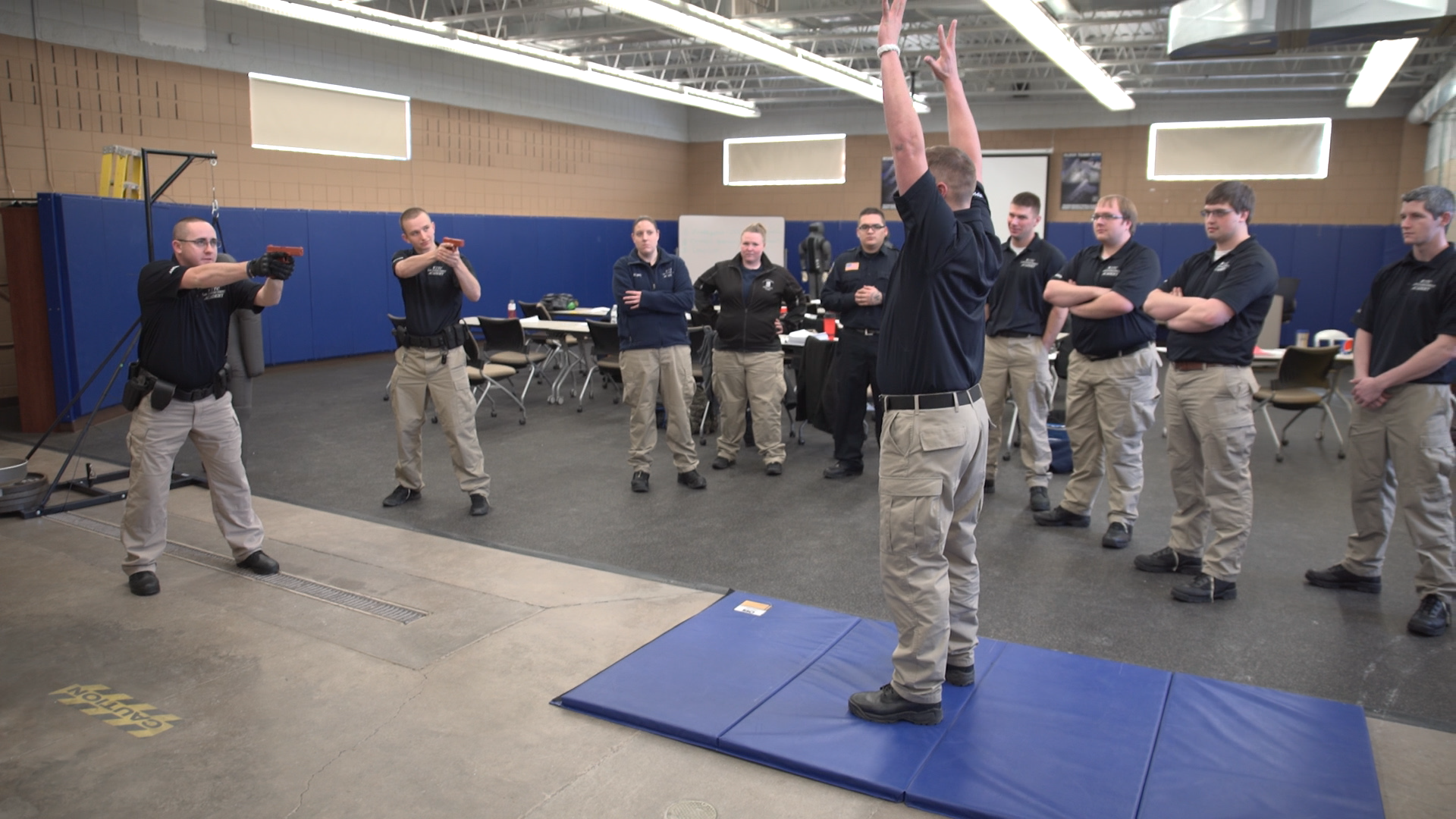 The Criminal Justice Academy students going through a simulation
