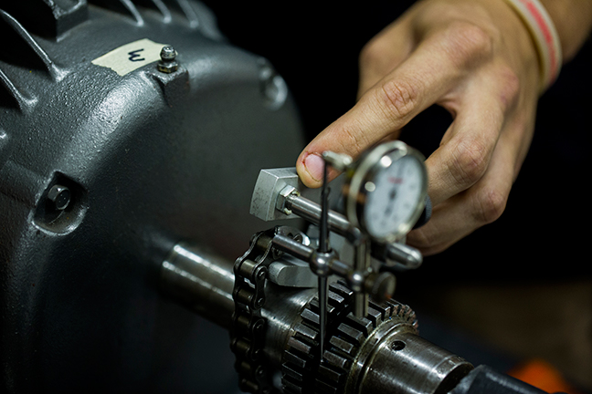 Close up of a hand touching a machine