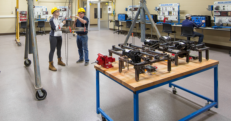 Millwright Apprenticeship An instructor works with a student on a machine